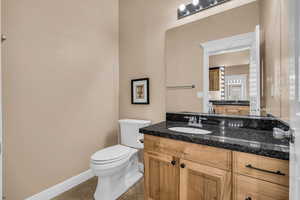 Bathroom featuring baseboards and vanity