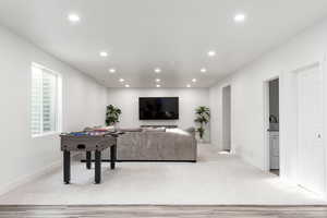 Living area featuring recessed lighting and light wood-type flooring