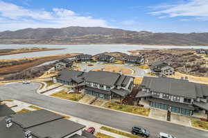Aerial view of residential area featuring a water and mountain view