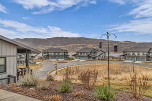 View of mountain backdrop with nearby suburban area