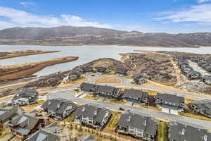 Aerial perspective of suburban area featuring a water and mountain view