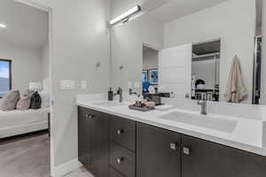 Bathroom featuring connected bathroom and double vanity