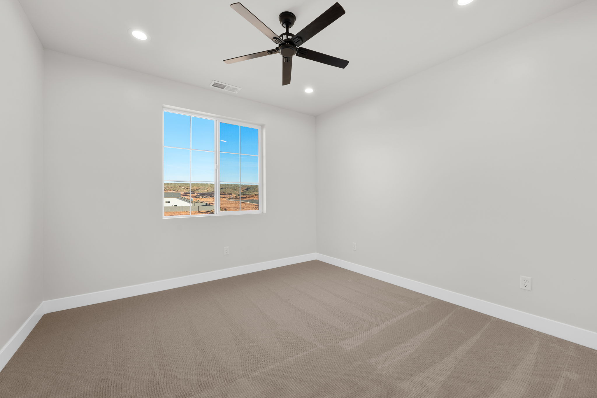 Carpeted spare room featuring recessed lighting and ceiling fan