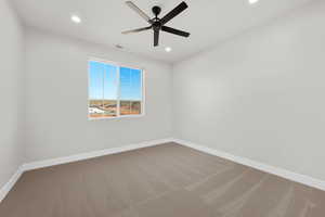 Carpeted spare room featuring recessed lighting and ceiling fan