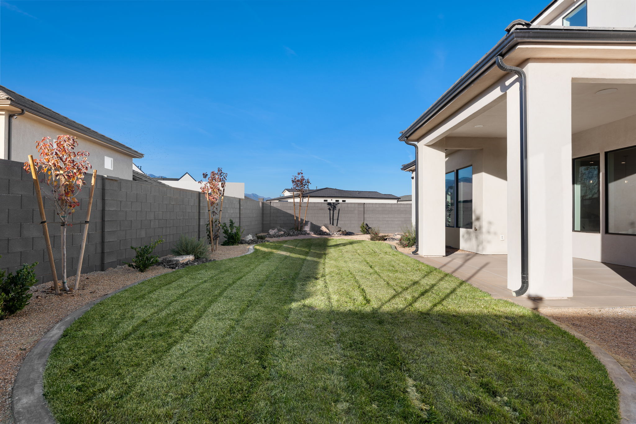 Fenced backyard featuring a patio