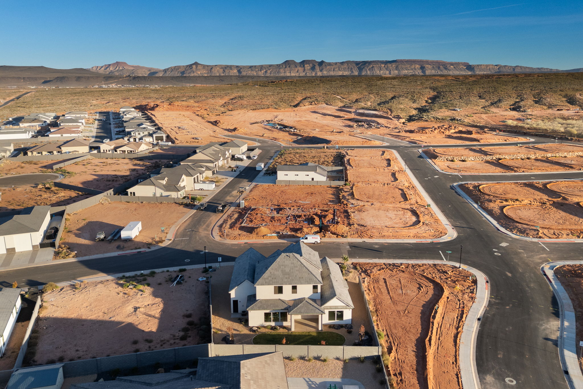 View of property location with mountains and nearby suburban area