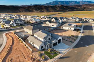 Aerial perspective of suburban area with a mountainous background