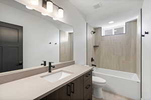 Full bath with vanity and shower / washtub combination