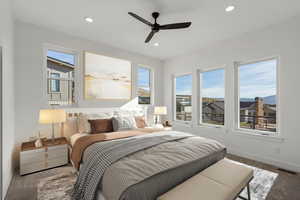 Bedroom featuring carpet floors, multiple windows, ceiling fan, and recessed lighting