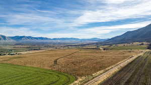 View of mountain backdrop featuring rural landscape