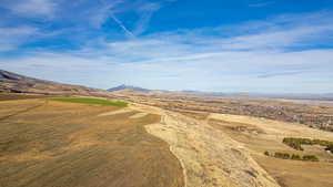 View of mountain background featuring rural landscape