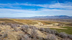 View of mountain background featuring rural landscape
