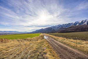 View of mountain backdrop featuring rural landscape