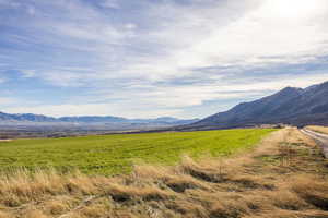 View of mountain backdrop featuring rural landscape