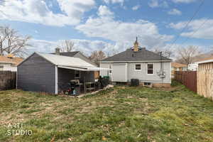 Rear view of property with a fenced backyard, a patio area, a chimney, and roof with shingles