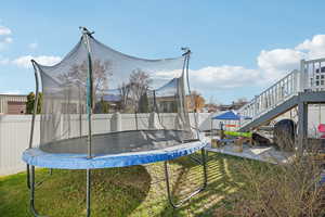 View of home's community with stairway and a fenced backyard