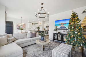Living room with a chandelier and wood finished floors