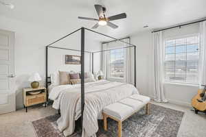Bedroom with light carpet and ceiling fan