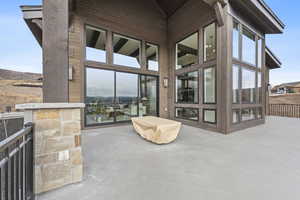 View of patio featuring a sunroom