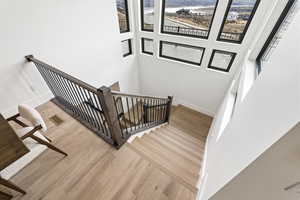 Stairway featuring wood finished floors and baseboards