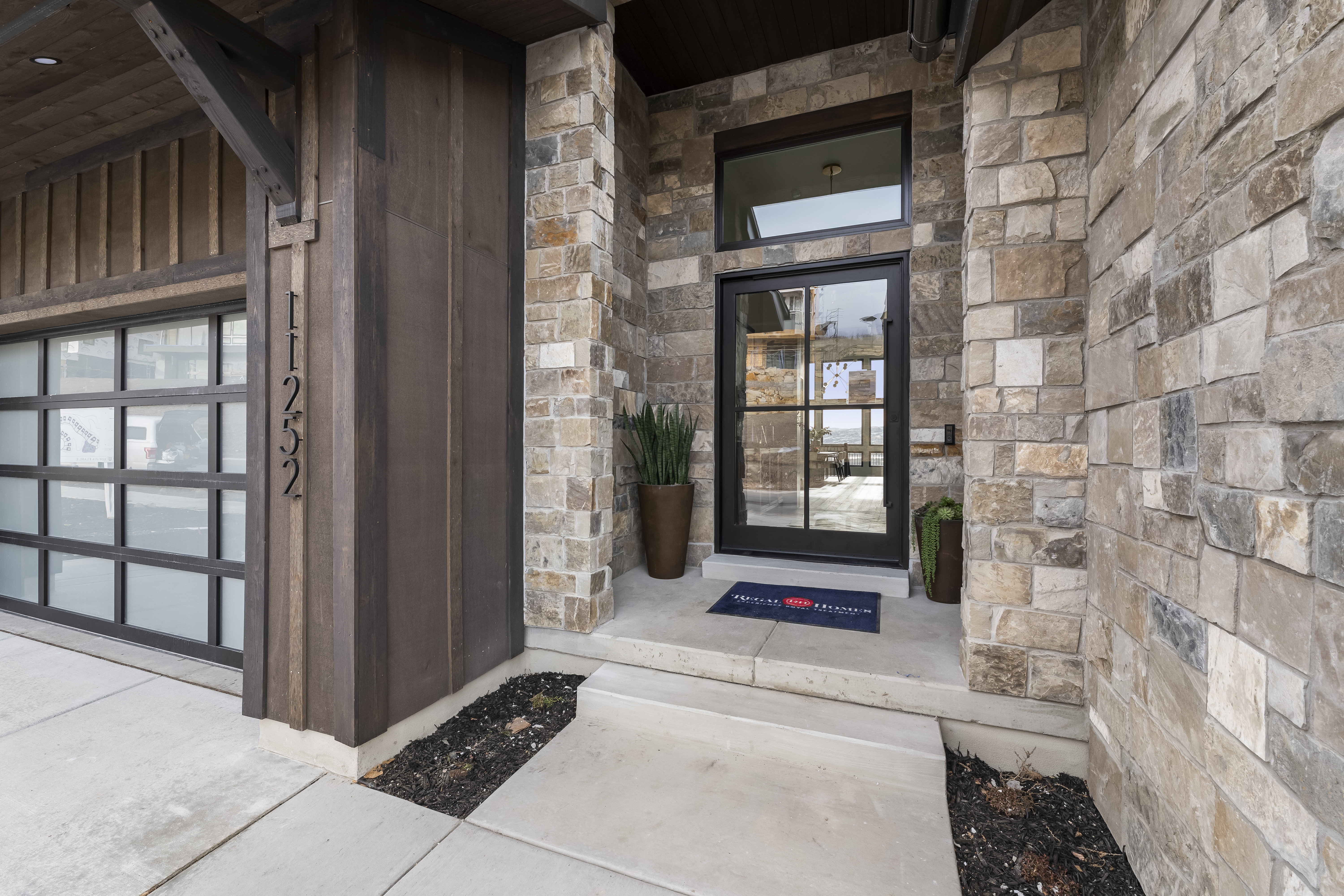 View of exterior entry with stone siding