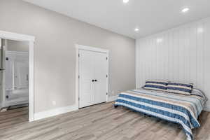 Bedroom featuring light wood-style flooring and recessed lighting