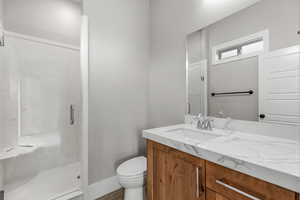 Full bath with a stall shower and vanity