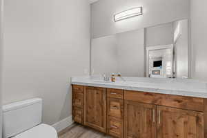 Bathroom featuring vanity and light wood-style floors
