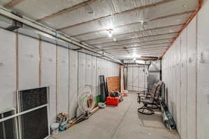 Unfinished below grade area with heating unit