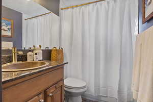 Full bath with vanity and shower / bath combo