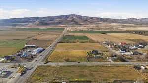 Aerial overview of property's location featuring rural landscape and abundant farmland