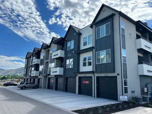 View of property with a mountain view