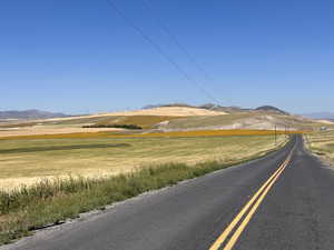 View of asphalt street with a mountain view and a view of countryside