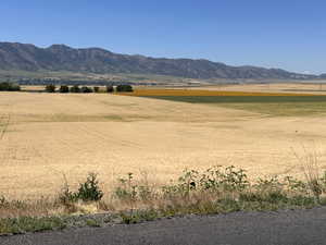 View of mountain backdrop featuring rural landscape
