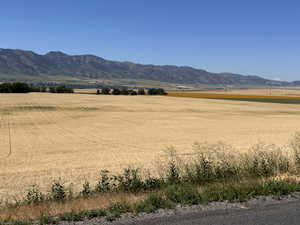 View of mountain background featuring rural landscape