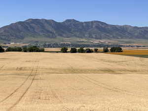 View of mountain backdrop with rural landscape