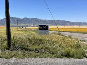 View of mountain backdrop featuring rural landscape