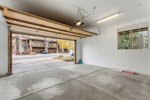Garage featuring a garage door opener
