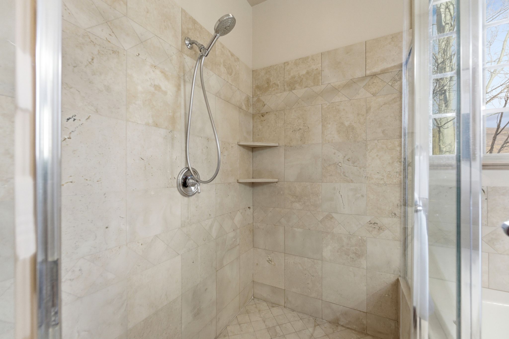 Full bathroom featuring a shower stall