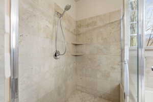 Full bathroom featuring a shower stall