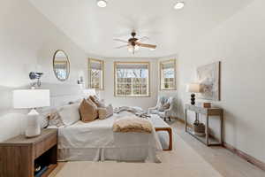 Bedroom featuring light colored carpet, ceiling fan, and recessed lighting