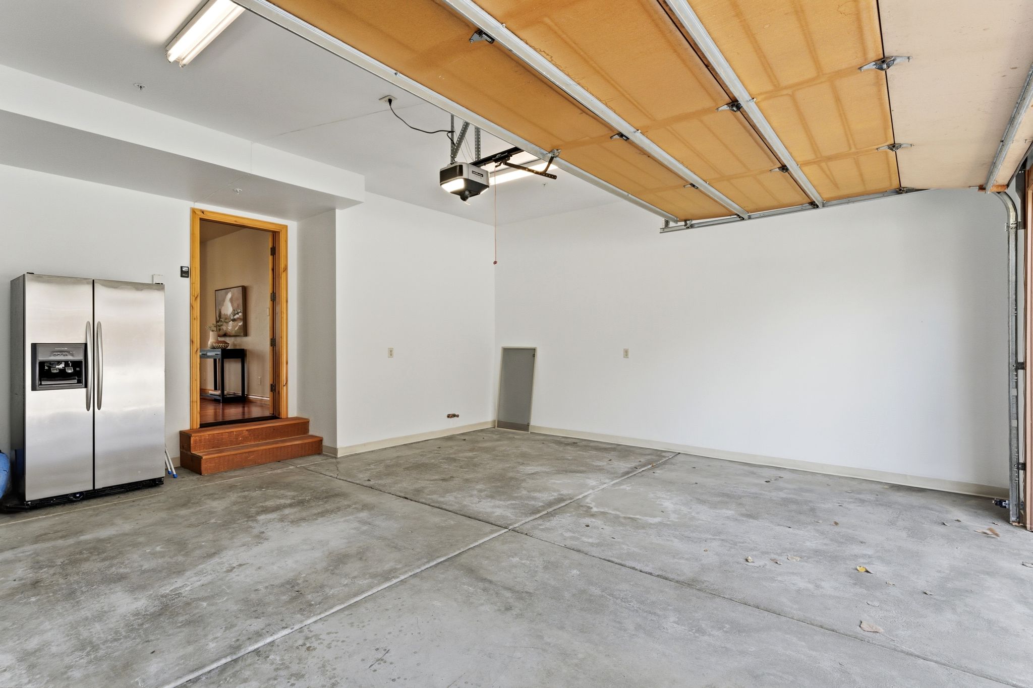 Garage with stainless steel fridge