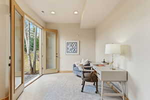 Office area with carpet and recessed lighting