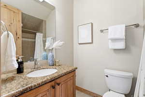 Bathroom with vanity and a shower with shower curtain