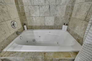 Bathroom with a jetted tub