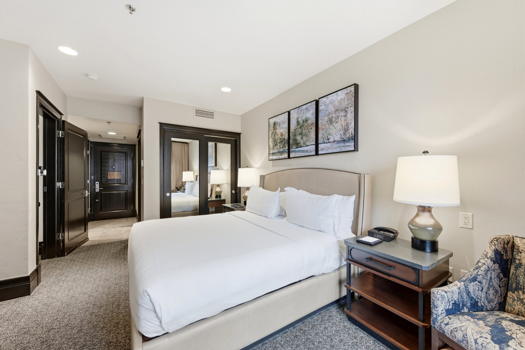 Bedroom featuring a closet, recessed lighting, and light carpet