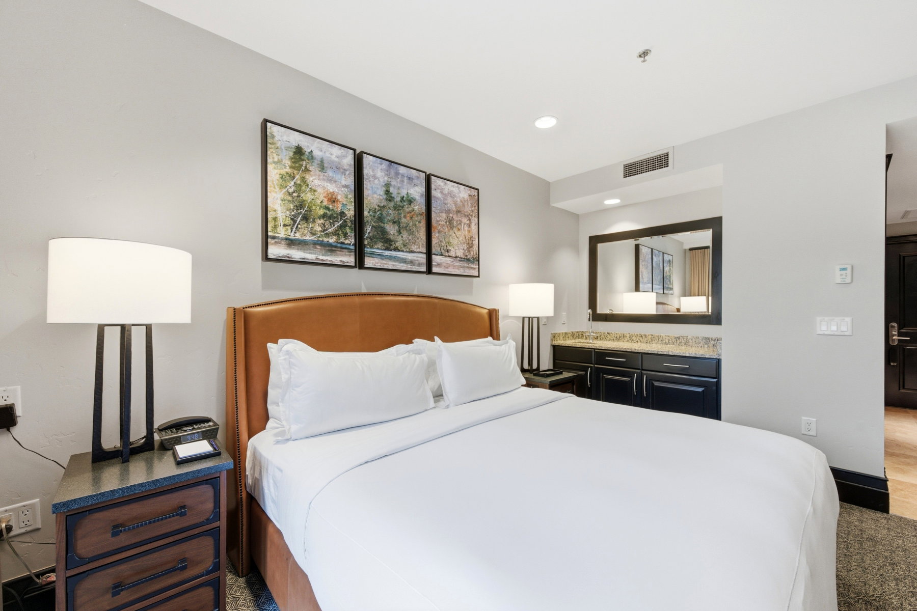 Carpeted bedroom with recessed lighting