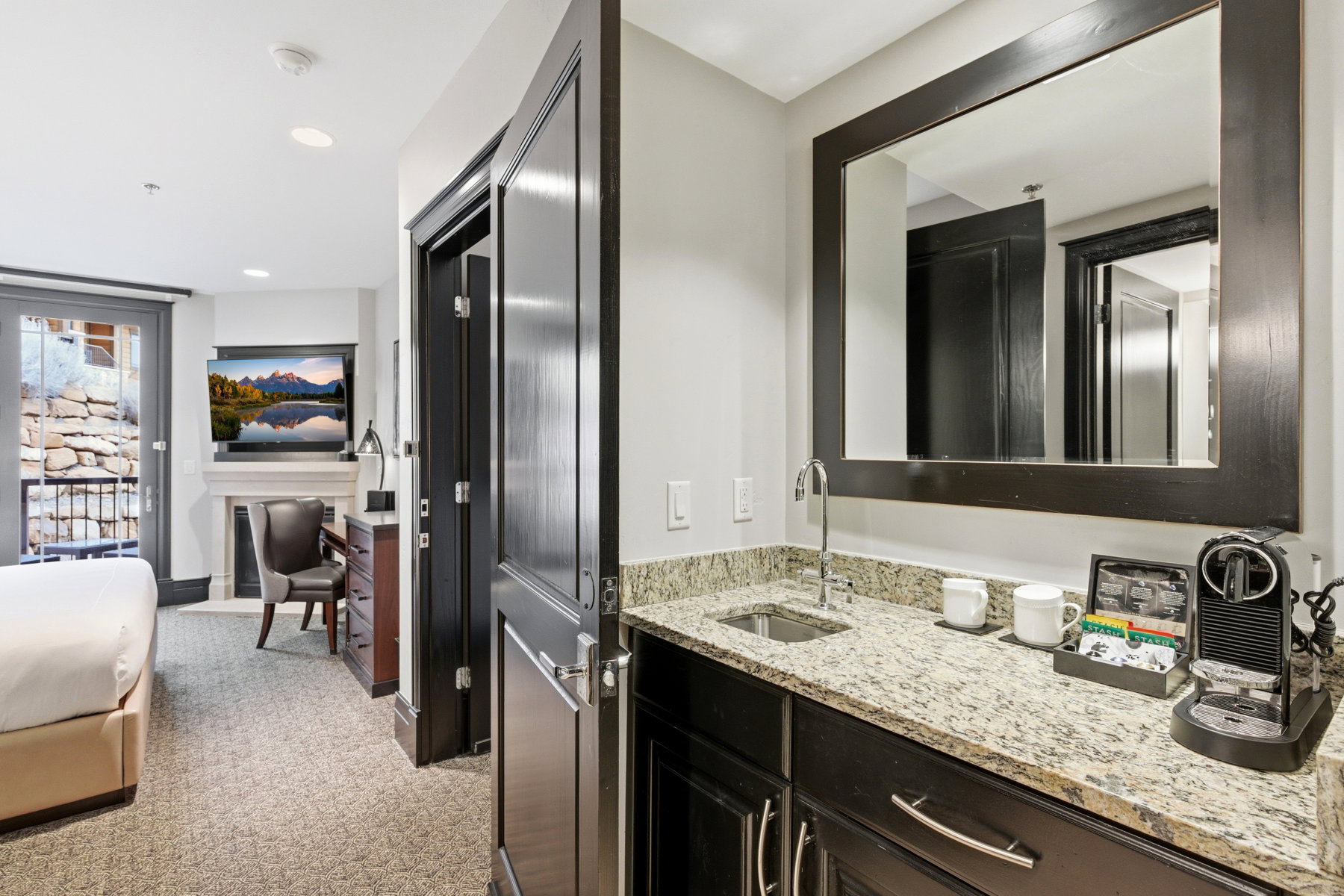Bathroom featuring vanity, light colored carpet, and recessed lighting