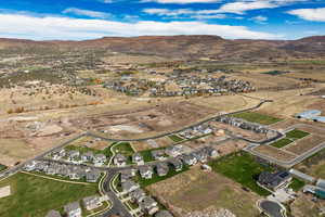 View of property location featuring a mountainous background and nearby suburban area