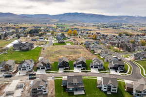 View of property location featuring nearby suburban area and a mountain backdrop
